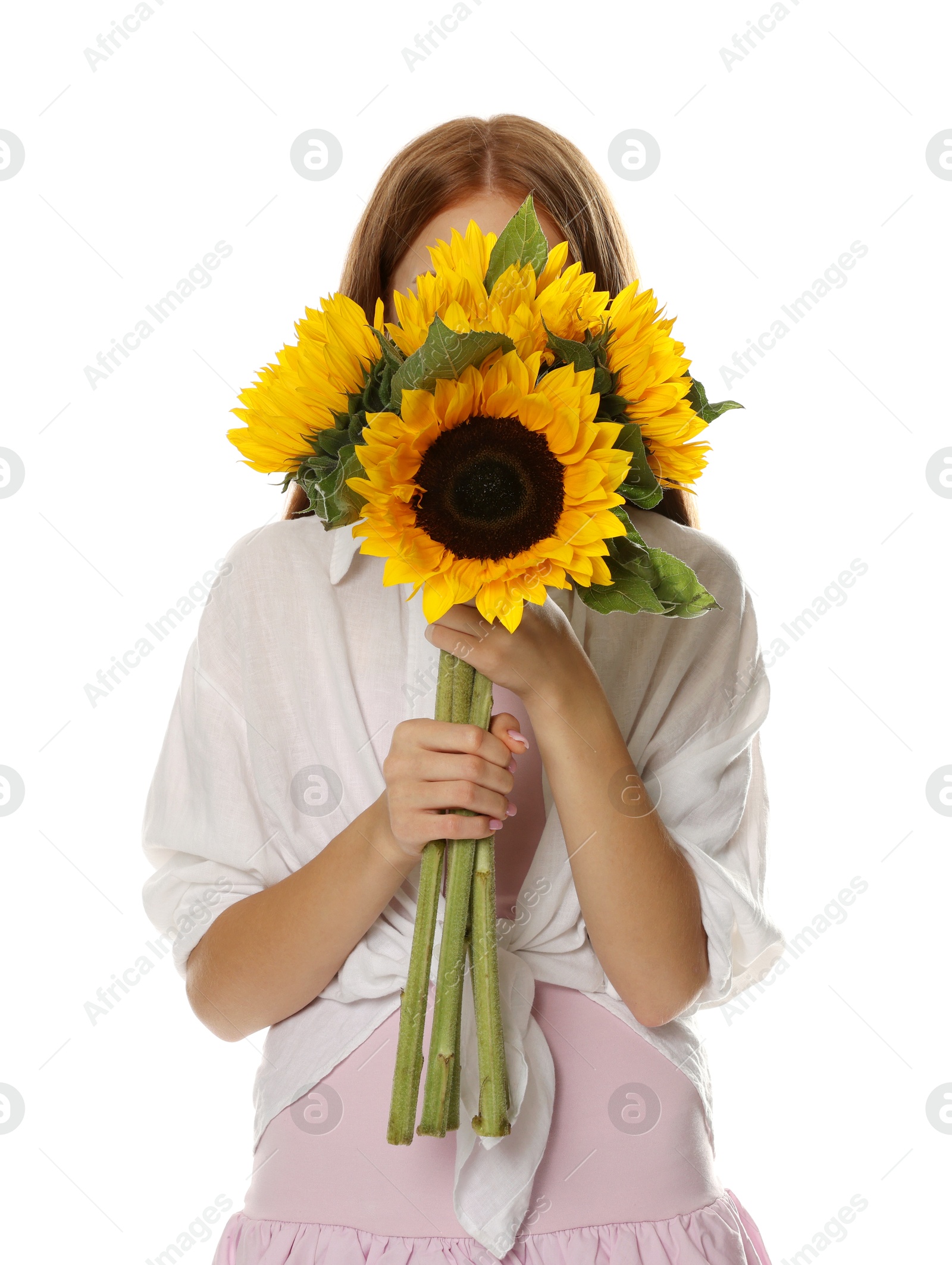 Photo of Teenage girl with bouquet of beautiful sunflowers on white background