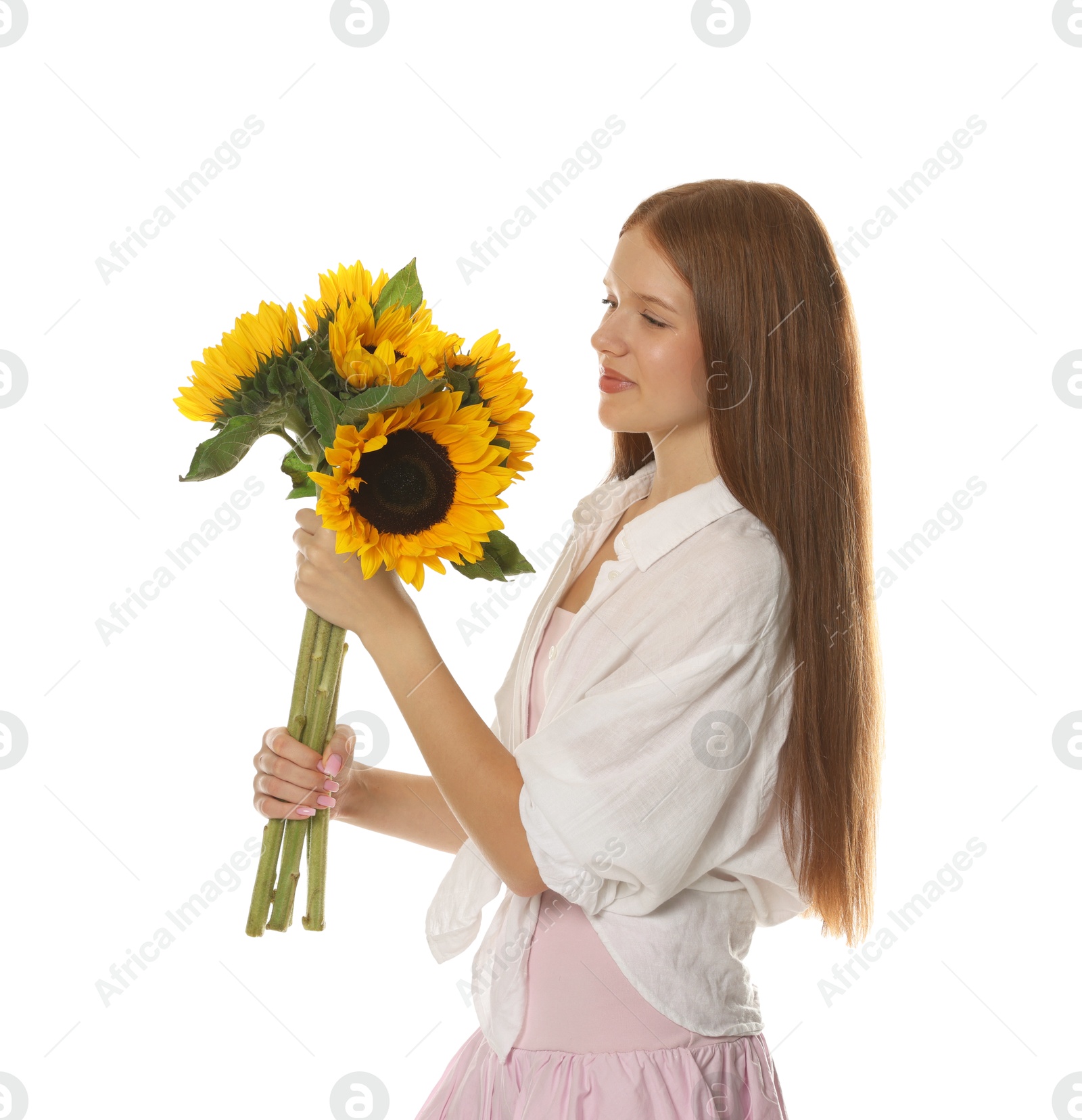 Photo of Teenage girl with bouquet of beautiful sunflowers on white background