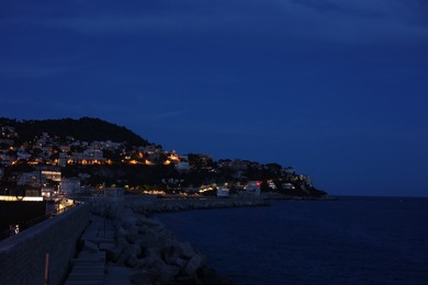 Photo of Beautiful view of coastal city in evening