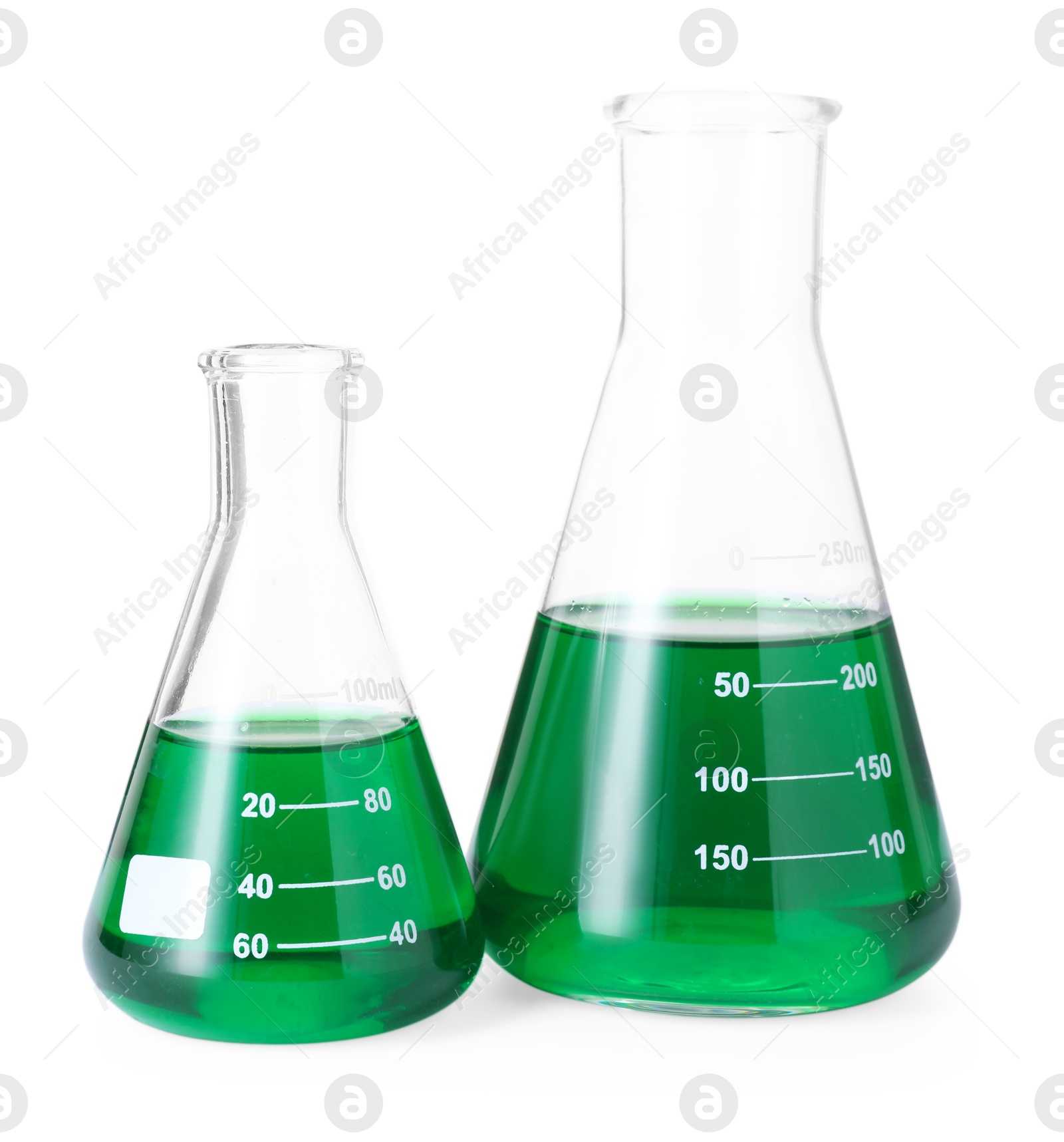 Photo of Glass flasks with green liquid isolated on white