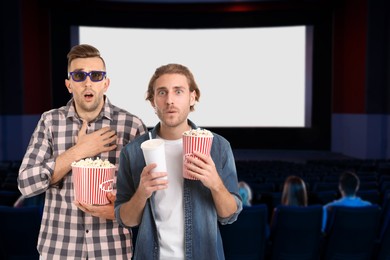 Image of Friends with buckets of popcorn in cinema