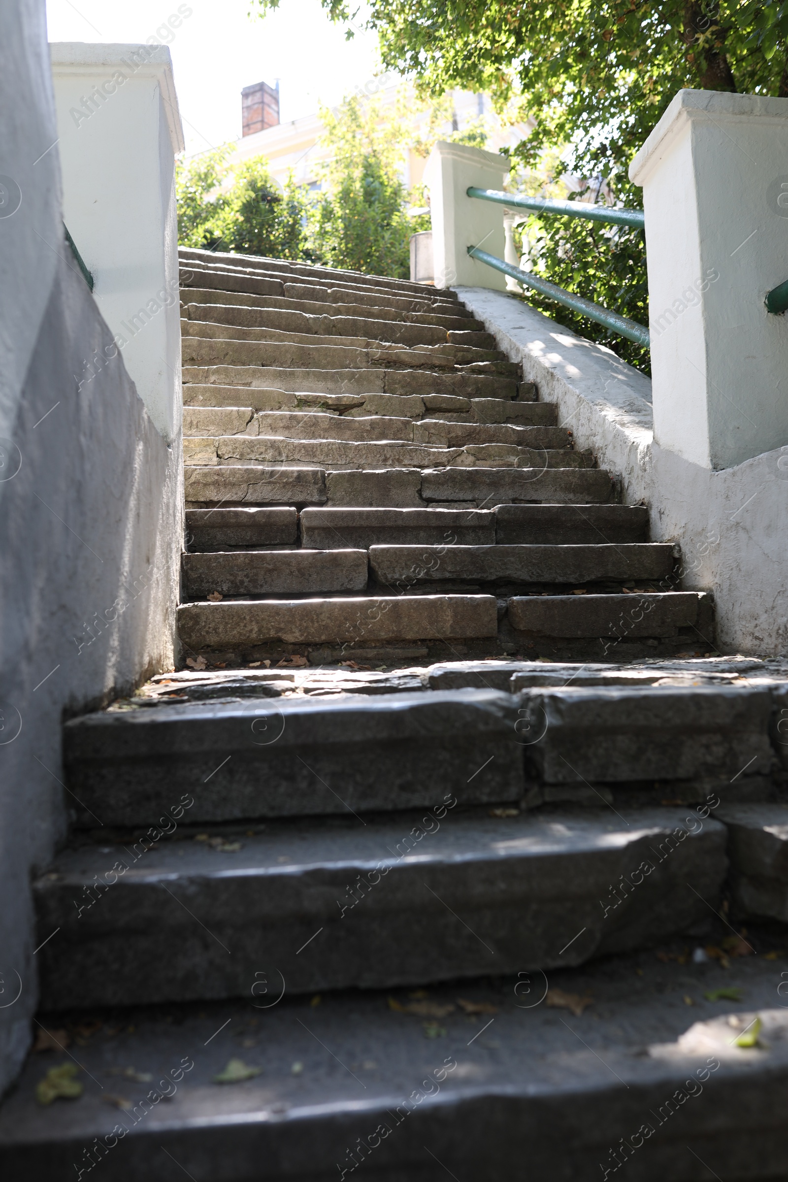 Photo of View of old concrete staircase outdoors on sunny day