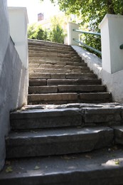 Photo of View of old concrete staircase outdoors on sunny day