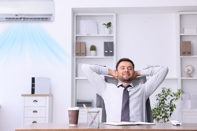 Image of Worker under air conditioner in office. Keeping comfortable temperature