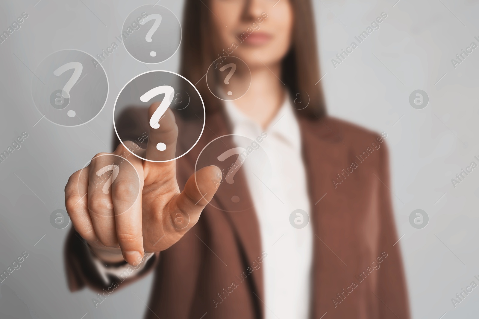Image of Business woman touching question mark on virtual screen against grey background, closeup
