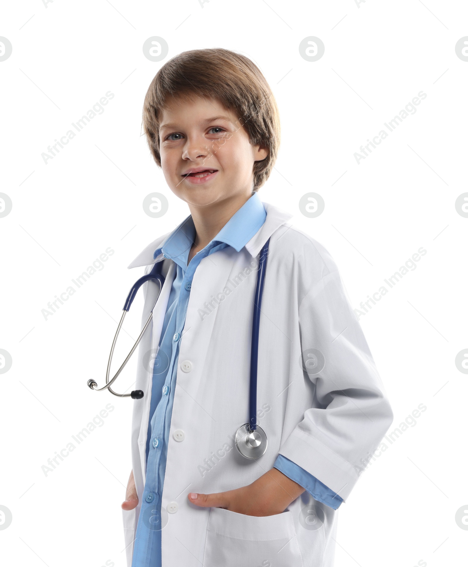 Photo of Choice of profession. Little boy in uniform with stethoscope pretending to be doctor on white background