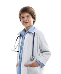 Photo of Choice of profession. Little boy in uniform with stethoscope pretending to be doctor on white background