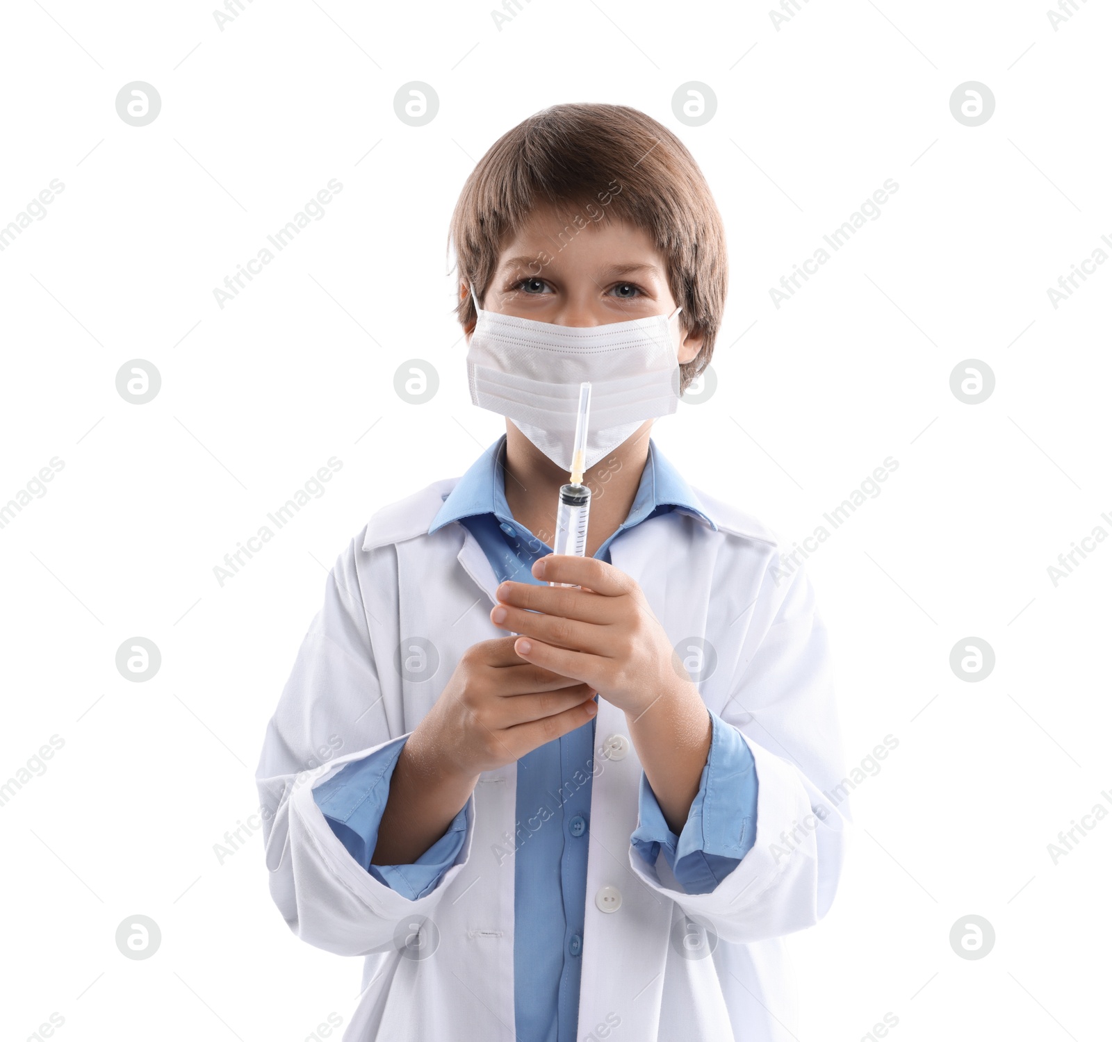 Photo of Choice of profession. Little boy in medical mask with syringe pretending to be doctor on white background