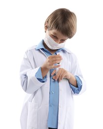 Photo of Choice of profession. Little boy in medical mask with syringe pretending to be doctor on white background