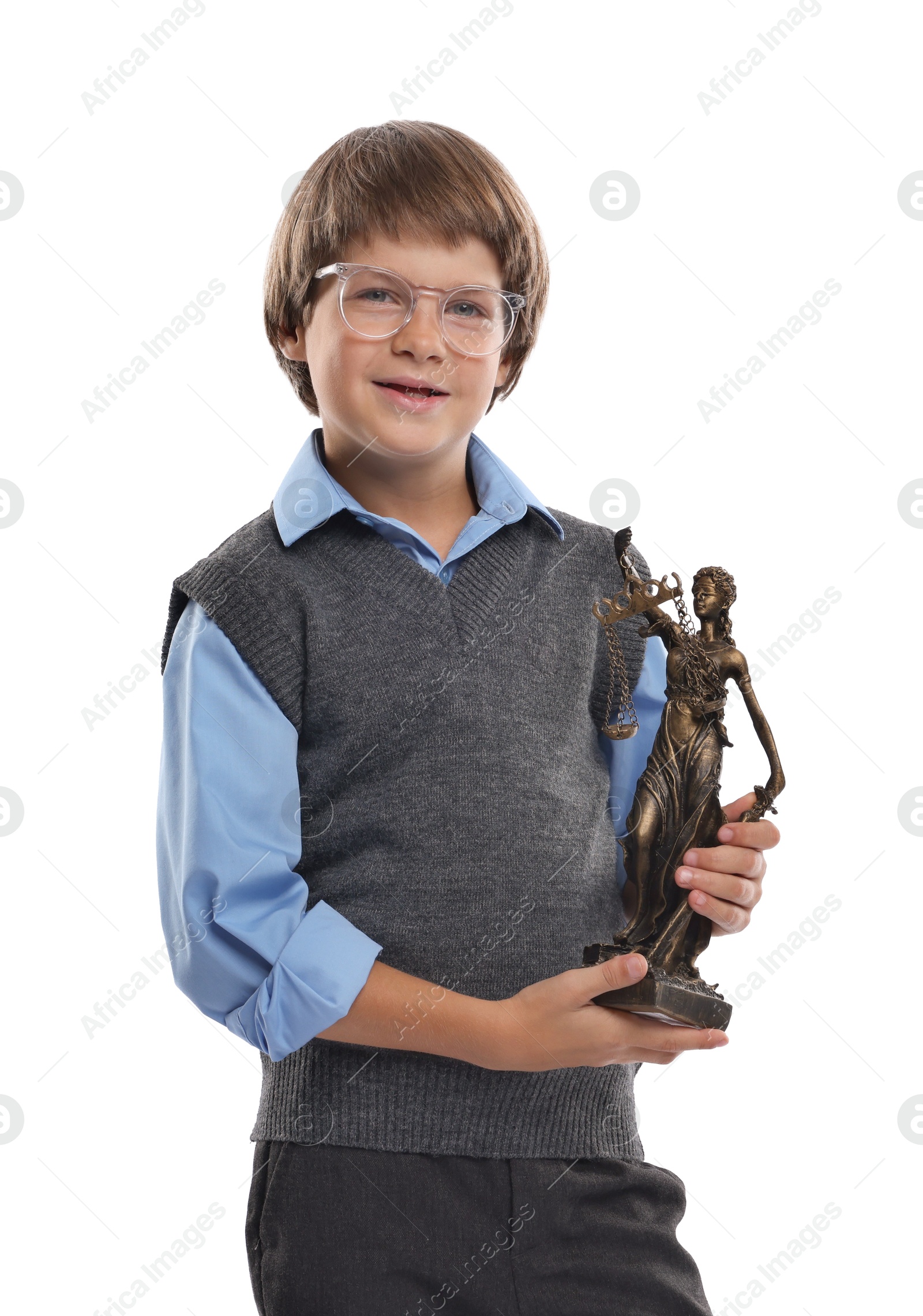Photo of Choice of profession. Happy little boy in glasses with statue of Lady Justice pretending to be lawyer on white background
