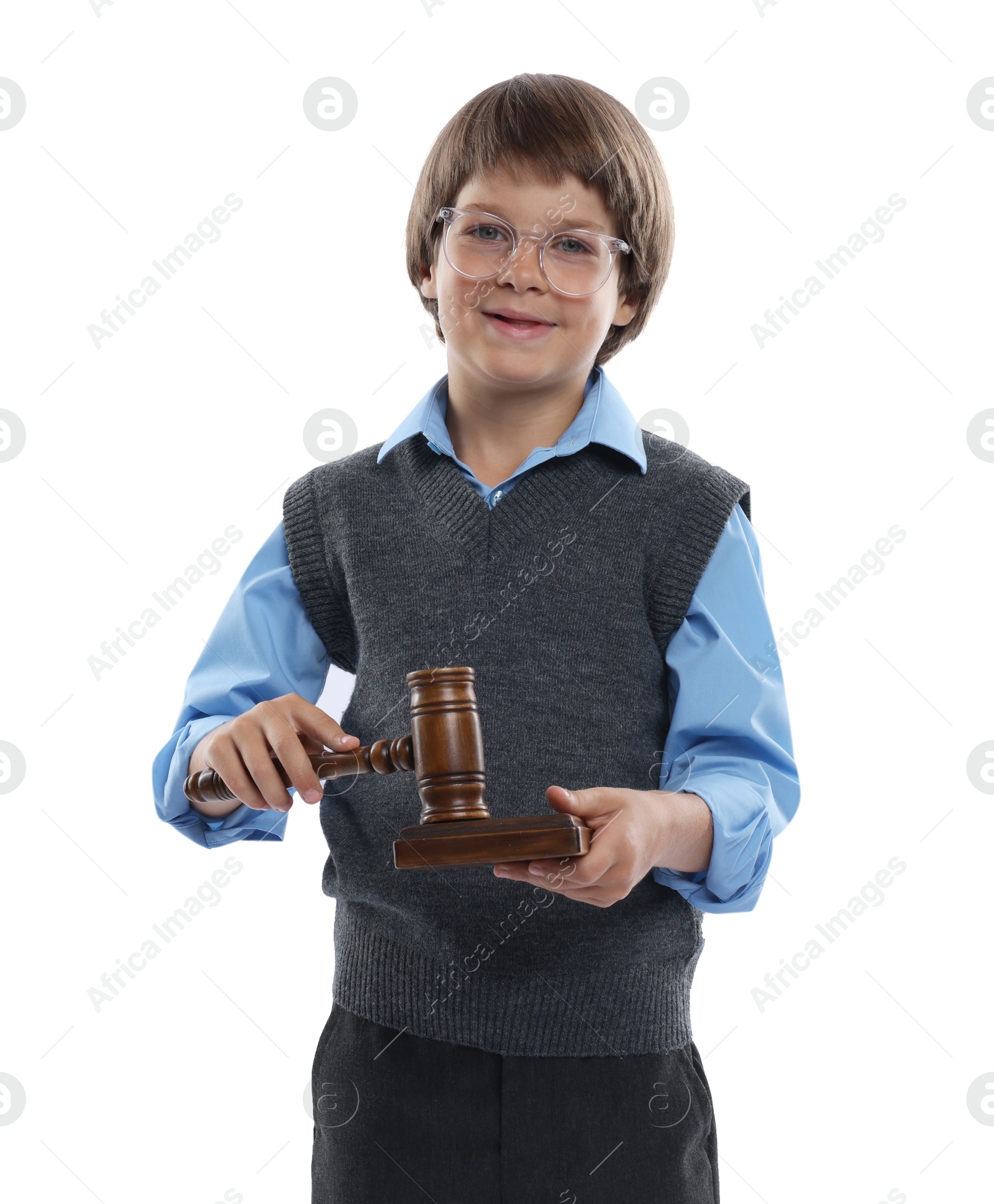 Photo of Choice of profession. Little boy in glasses with judge's gavel and sound block pretending to be lawyer on white background