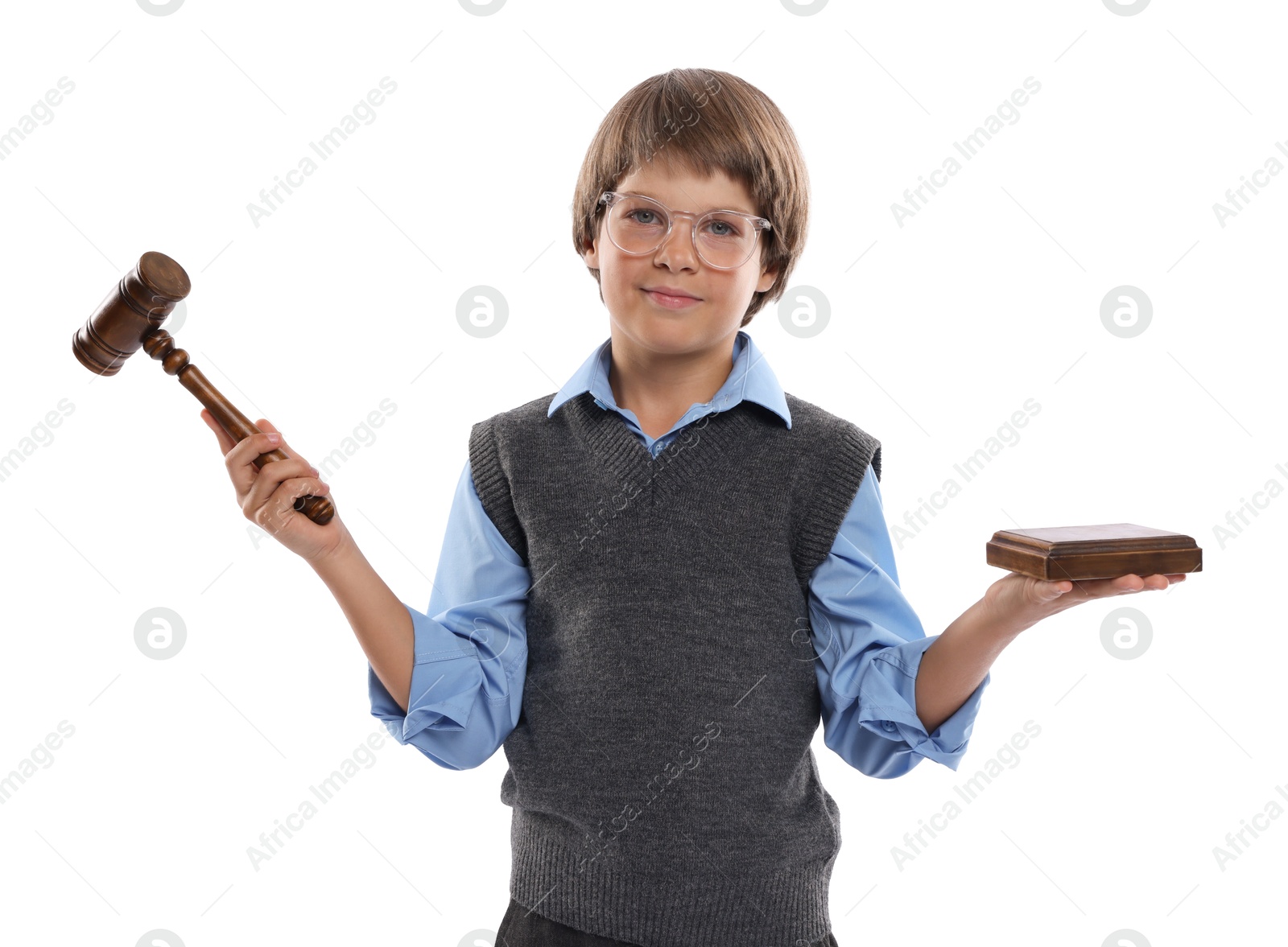 Photo of Choice of profession. Little boy in glasses with judge's gavel and sound block pretending to be lawyer on white background