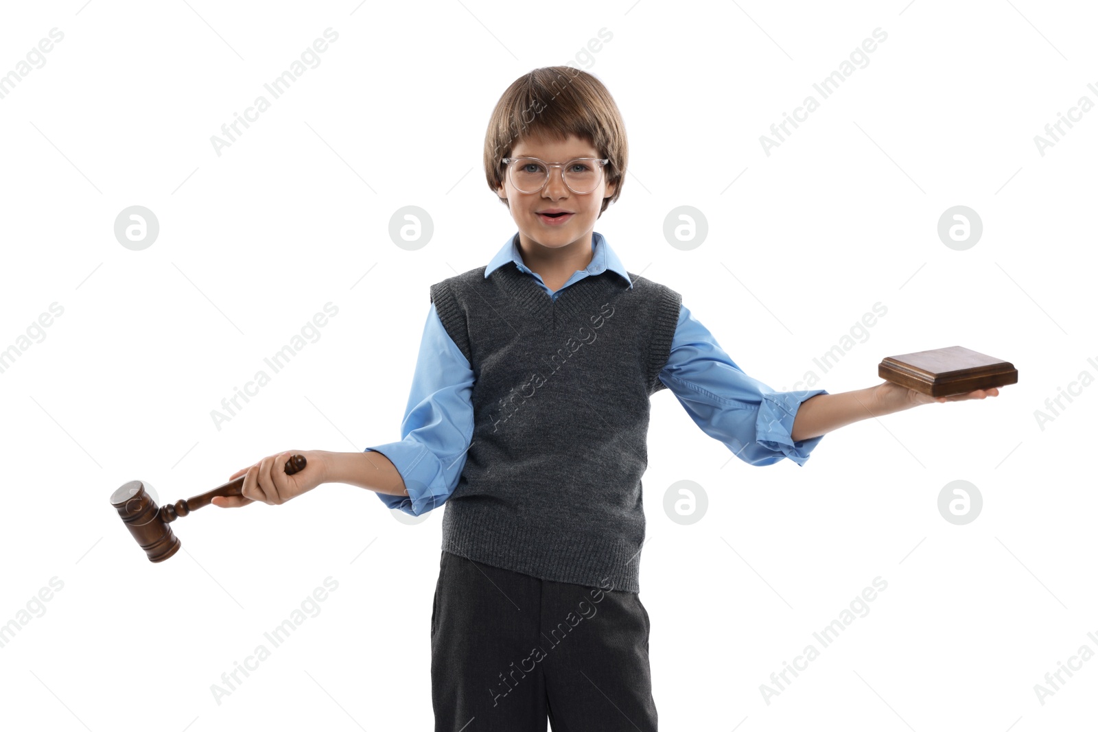 Photo of Choice of profession. Little boy in glasses with judge's gavel and sound block pretending to be lawyer on white background