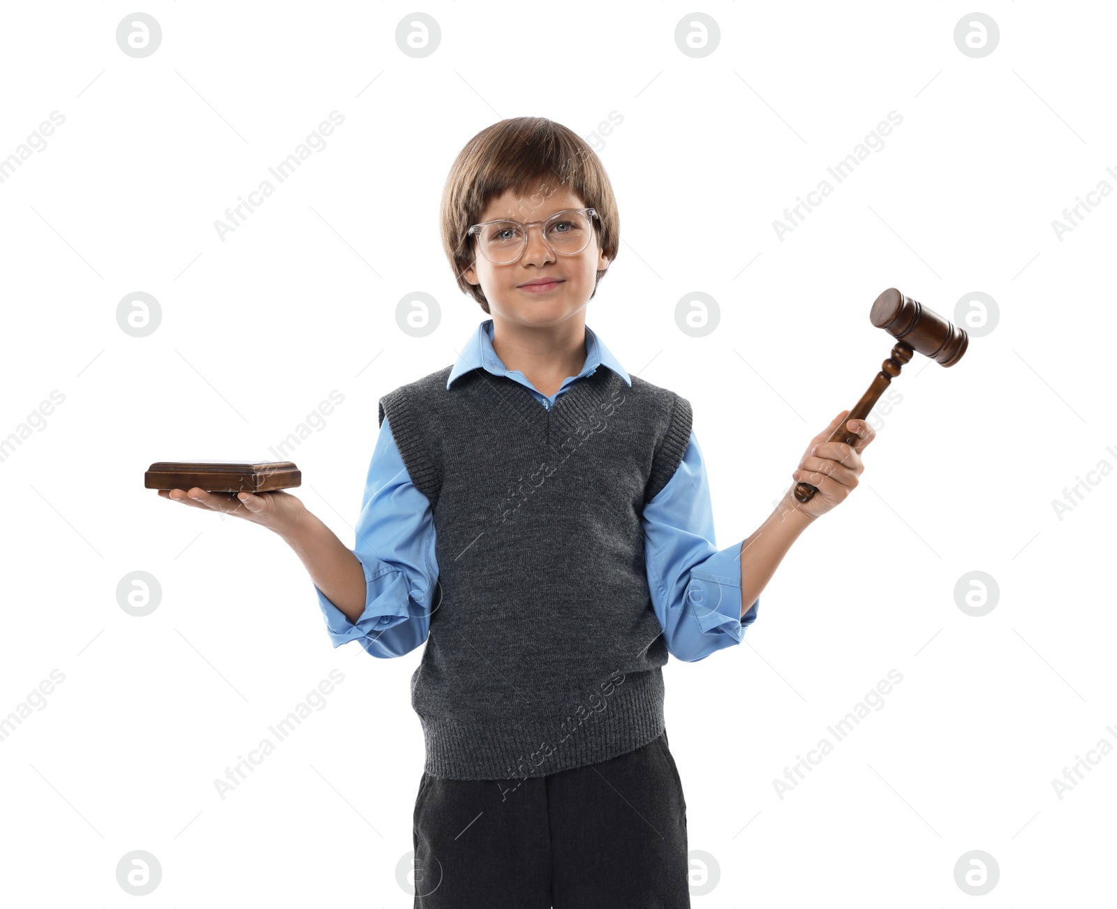 Photo of Choice of profession. Little boy in glasses with judge's gavel and sound block pretending to be lawyer on white background