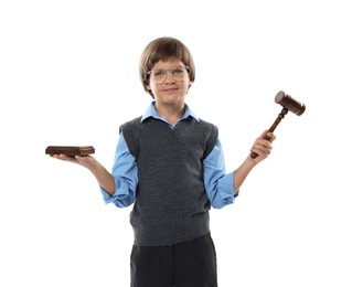 Photo of Choice of profession. Little boy in glasses with judge's gavel and sound block pretending to be lawyer on white background