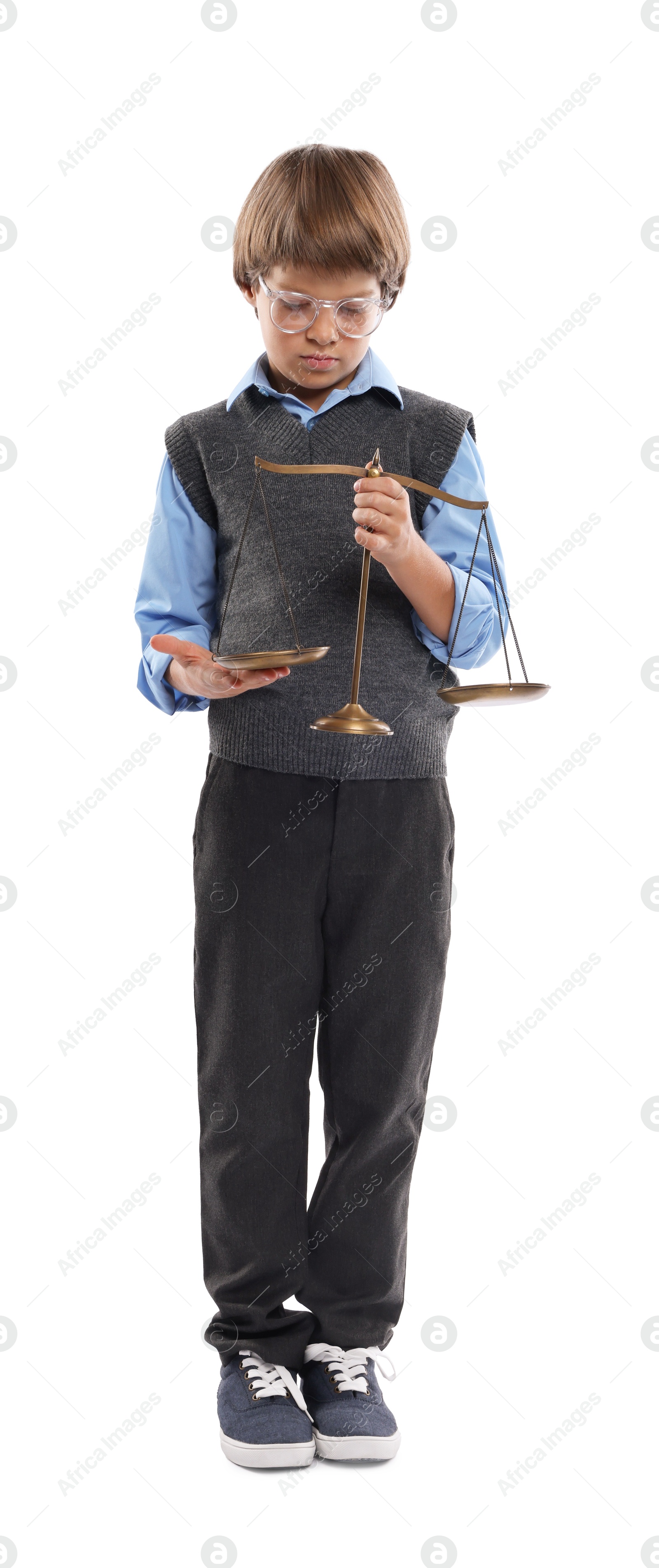 Photo of Choice of profession. Little boy in glasses with scales of justice pretending to be lawyer on white background