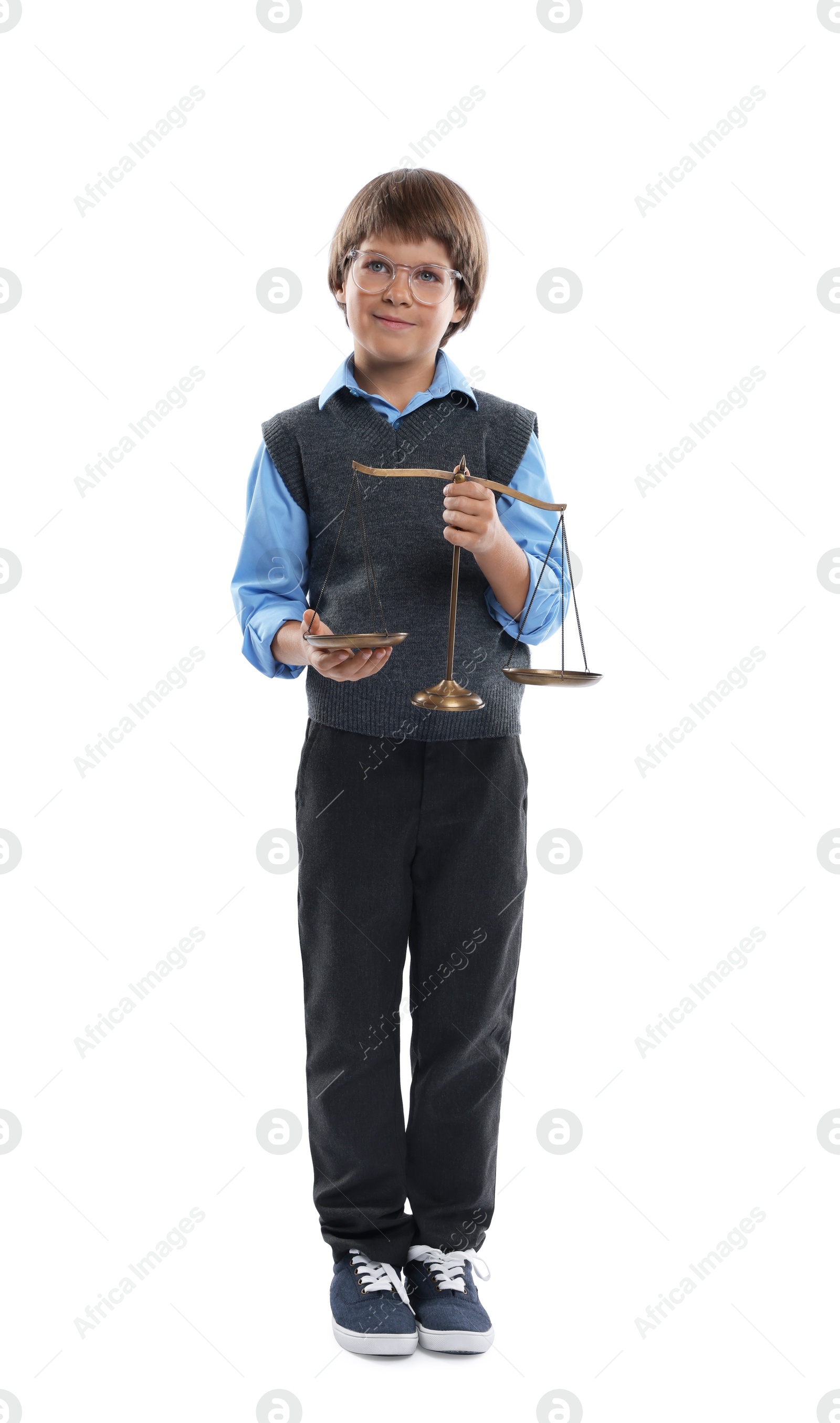 Photo of Choice of profession. Little boy in glasses with scales of justice pretending to be lawyer on white background