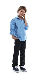 Photo of Choice of profession. Little boy talking by smartphone pretending to be businessman on white background