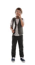 Photo of Choice of profession. Little boy in glasses talking by smartphone pretending to work with laptop on white background