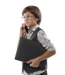 Photo of Choice of profession. Little boy in glasses talking by smartphone pretending to work with laptop on white background
