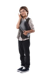 Photo of Choice of profession. Little boy in glasses talking by smartphone pretending to work with laptop on white background