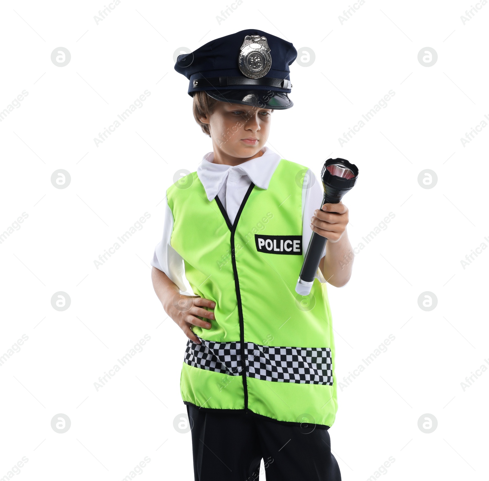 Photo of Choice of profession. Little boy in uniform with flashlight pretending to be policeman on white background