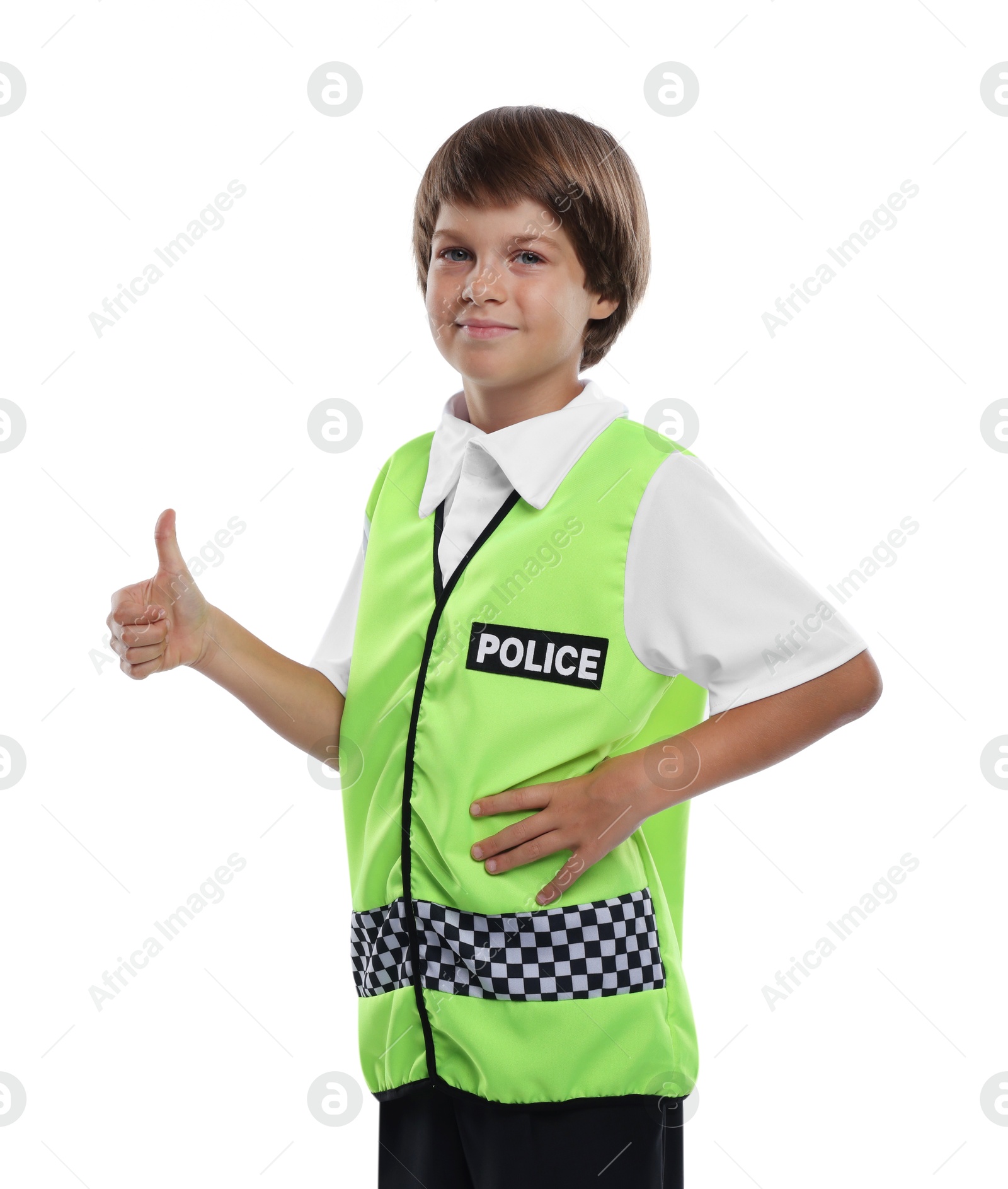 Photo of Choice of profession. Little boy in uniform showing thumbs up pretending to be policeman on white background
