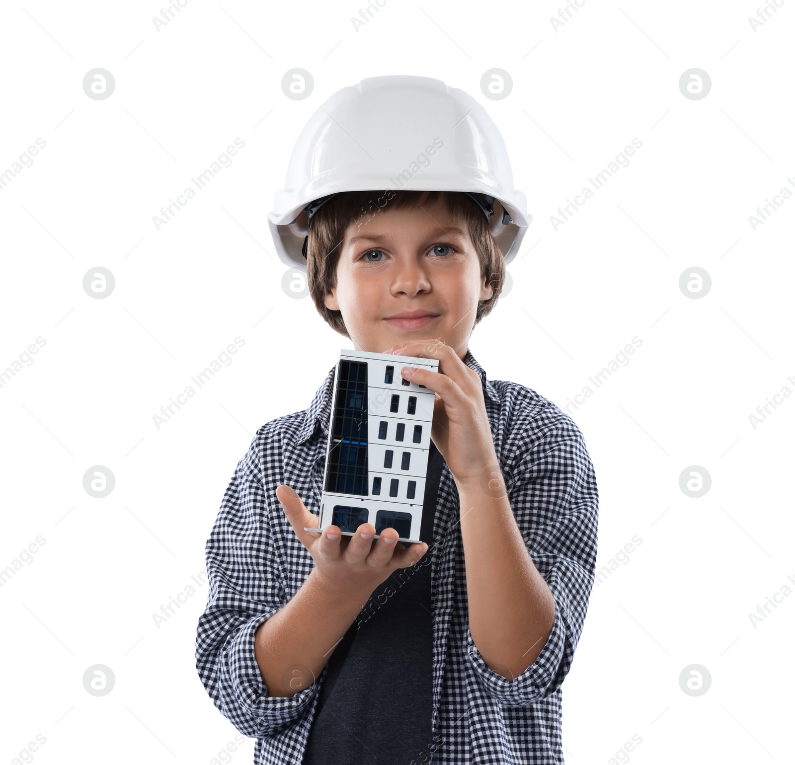 Photo of Choice of profession. Little boy in hardhat with building model pretending to be architect on white background