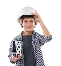 Photo of Choice of profession. Little boy in hardhat with building model pretending to be architect on white background