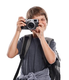Photo of Choice of profession. Little boy with camera and backpack pretending to be photographer on white background