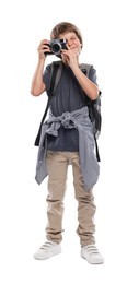 Photo of Choice of profession. Little boy with camera and backpack pretending to be photographer on white background