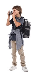 Photo of Choice of profession. Little boy with camera and backpack pretending to be photographer on white background