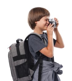Photo of Choice of profession. Little boy with camera and backpack pretending to be photographer on white background