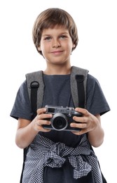 Photo of Choice of profession. Little boy with camera and backpack pretending to be photographer on white background