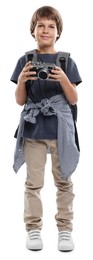 Photo of Choice of profession. Little boy with camera and backpack pretending to be photographer on white background