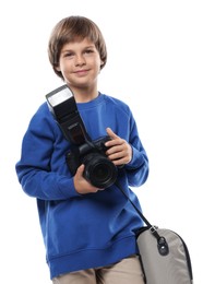 Photo of Choice of profession. Little boy with camera and bag pretending to be photographer on white background