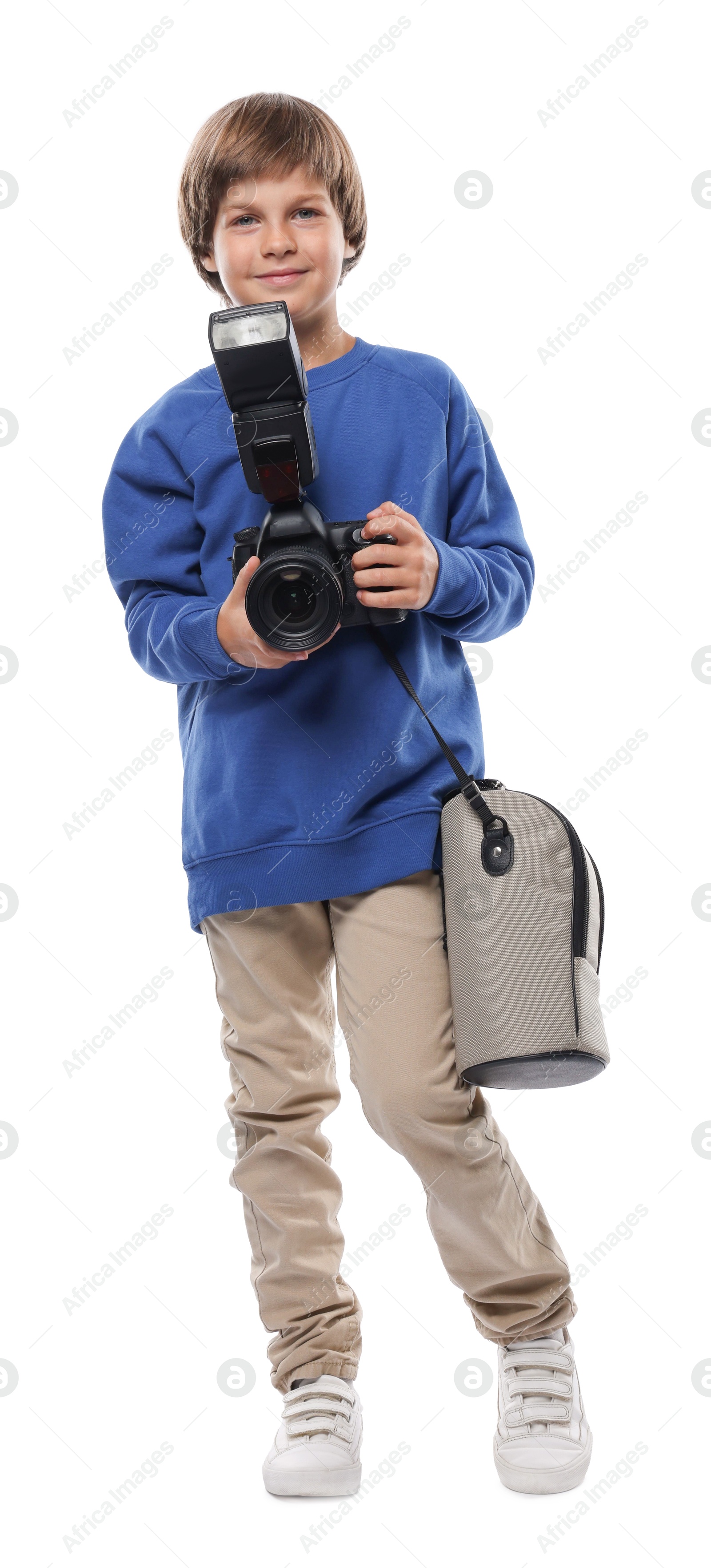 Photo of Choice of profession. Little boy with camera and bag pretending to be photographer on white background