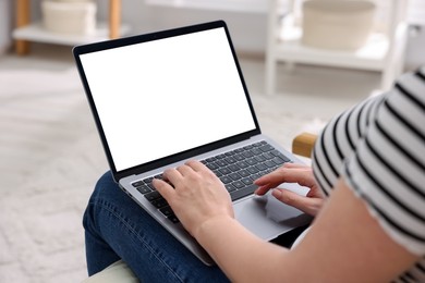 Photo of Woman working with laptop indoors, closeup. Mockup for design
