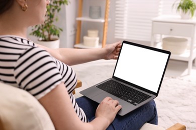 Photo of Woman working with laptop indoors, closeup. Mockup for design