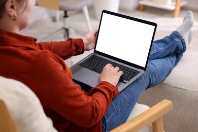 Photo of Woman working with laptop indoors, closeup. Mockup for design