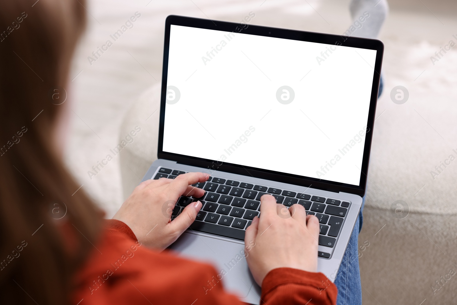 Photo of Woman working with laptop indoors, closeup. Mockup for design