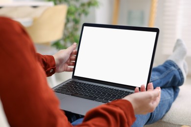 Photo of Woman working with laptop indoors, closeup. Mockup for design
