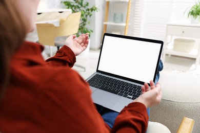 Photo of Woman working with laptop indoors, closeup. Mockup for design