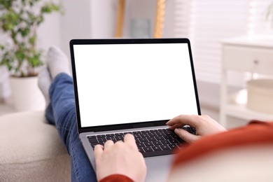 Photo of Woman working with laptop indoors, closeup. Mockup for design