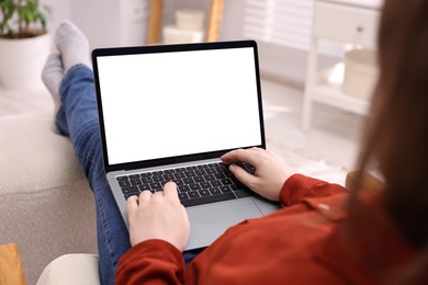 Photo of Woman working with laptop indoors, closeup. Mockup for design