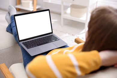 Photo of Woman working with laptop indoors, closeup. Mockup for design