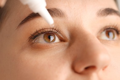 Photo of Young woman applying eye drops, closeup view