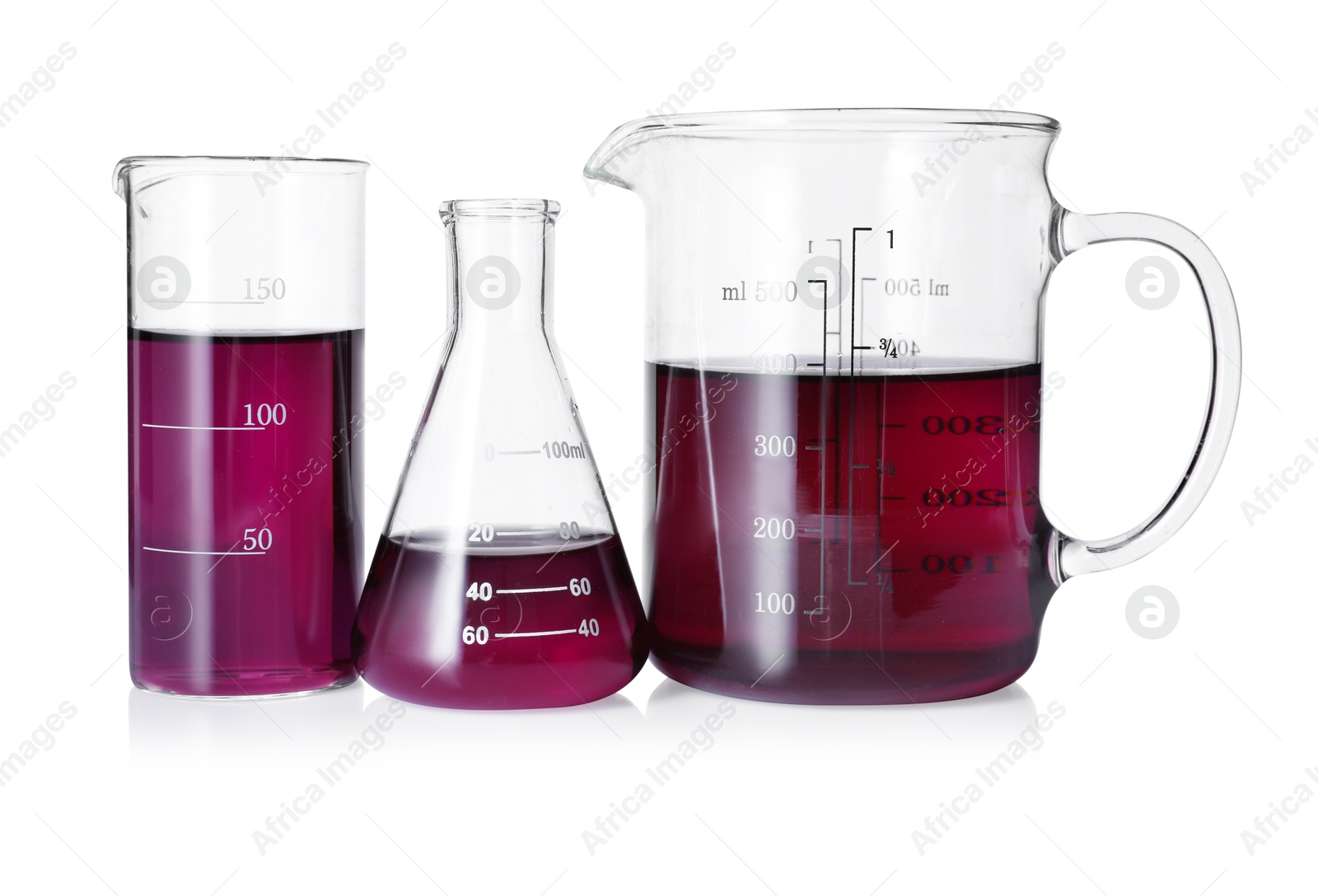 Photo of Different laboratory glassware with color liquid isolated on white