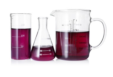 Photo of Different laboratory glassware with color liquid isolated on white