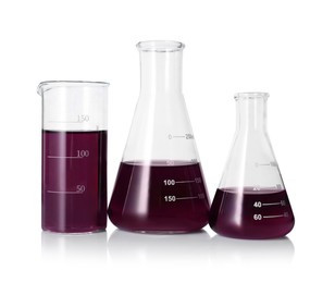 Photo of Different laboratory glassware with color liquid isolated on white